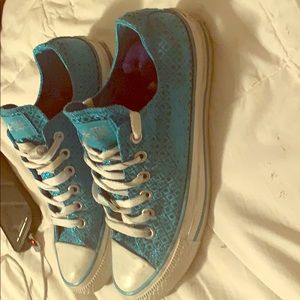 Converse turquoise blue with sparkles.